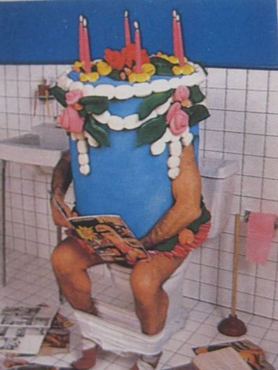 cake sitting on a toilet